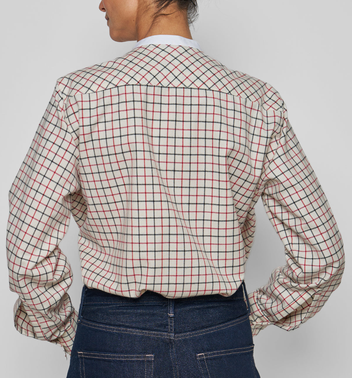 Women's Bunny Shirt – back view of cropped beige Tattersall shirt, worn with dark blue jeans