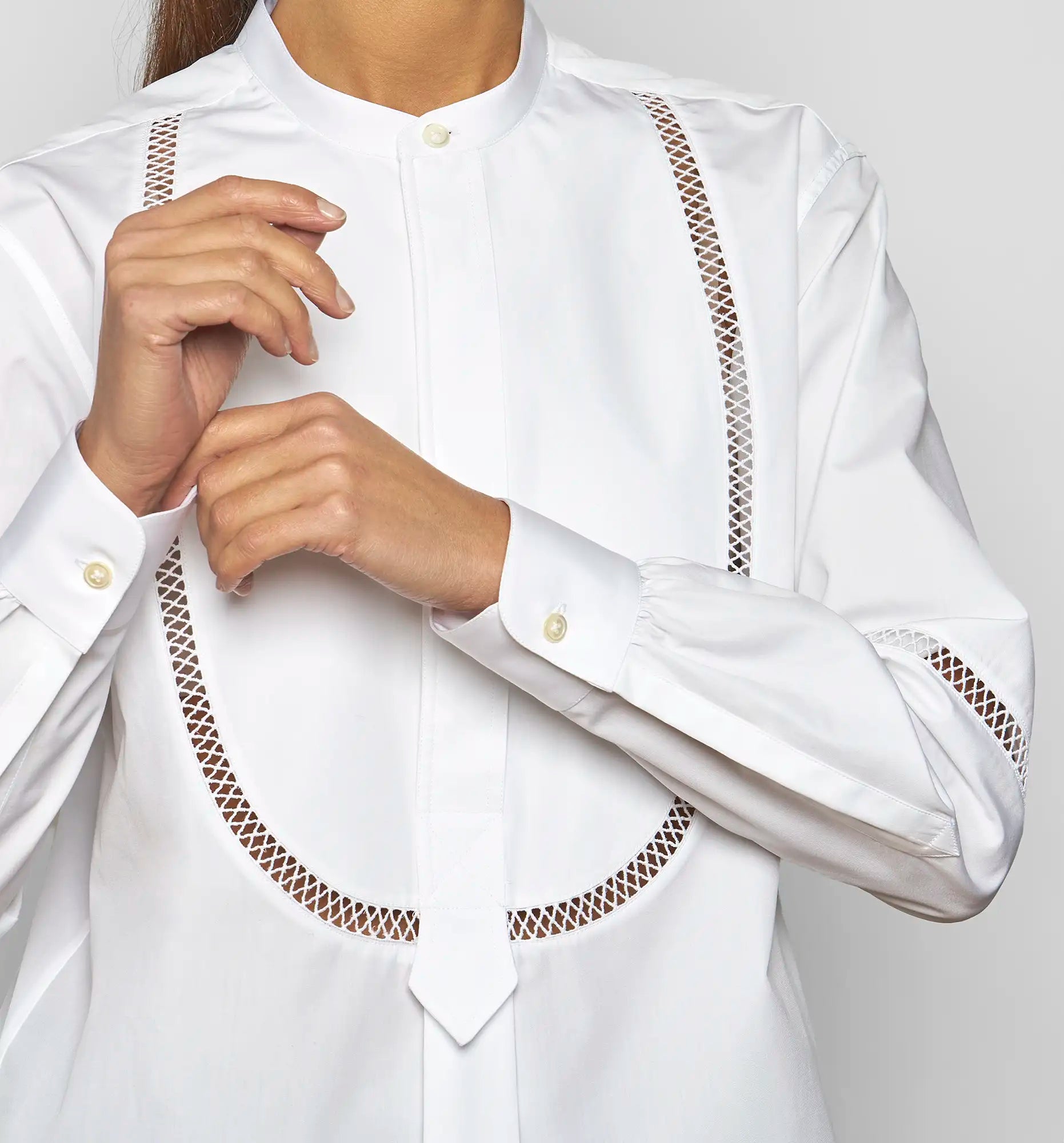 Close-up of the bib detail with decorative hemstitch on the white Venetian Painter’s Shirt by Sébline.