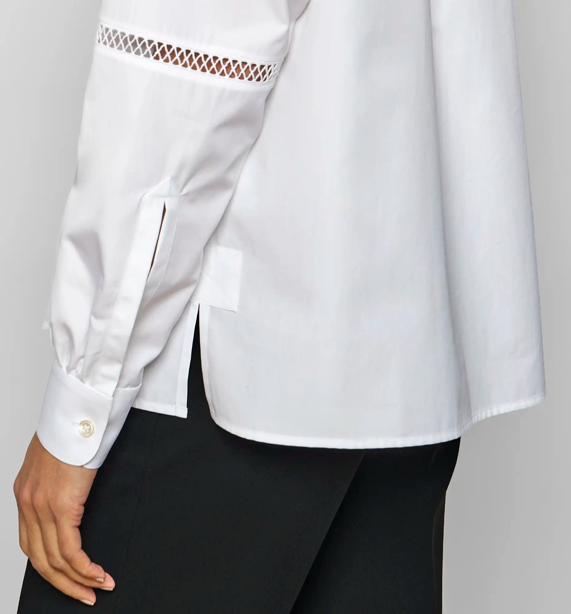 Close-up of the cuff gathering and decorative hemstitch detail on the white Venetian Painter’s Shirt by Sébline.