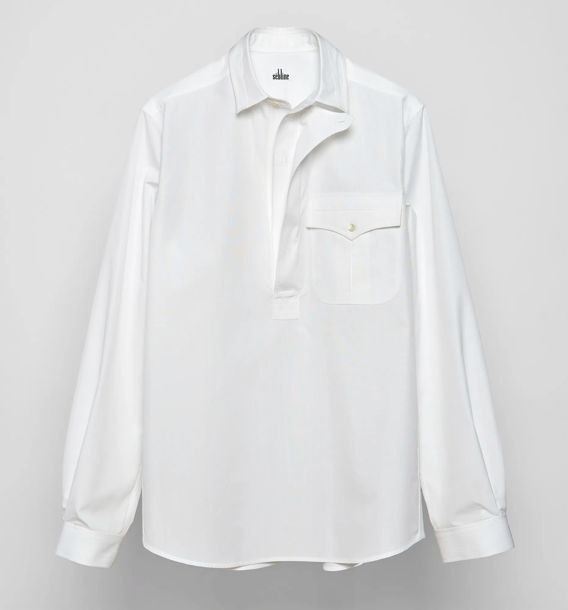 Front view of a white Sébline shirt on a neutral background