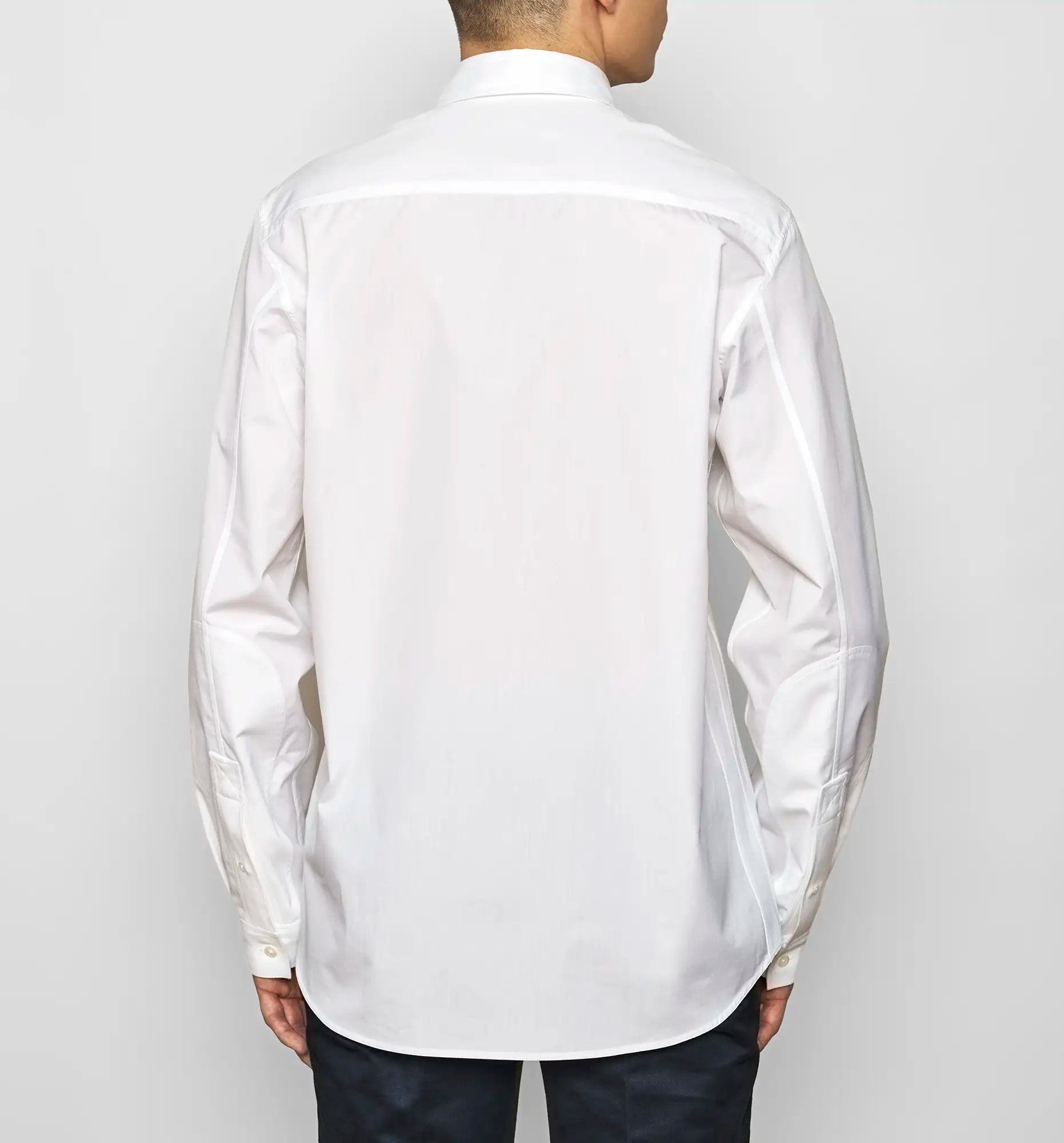 Back view of a white Sébline shirt worn by a model