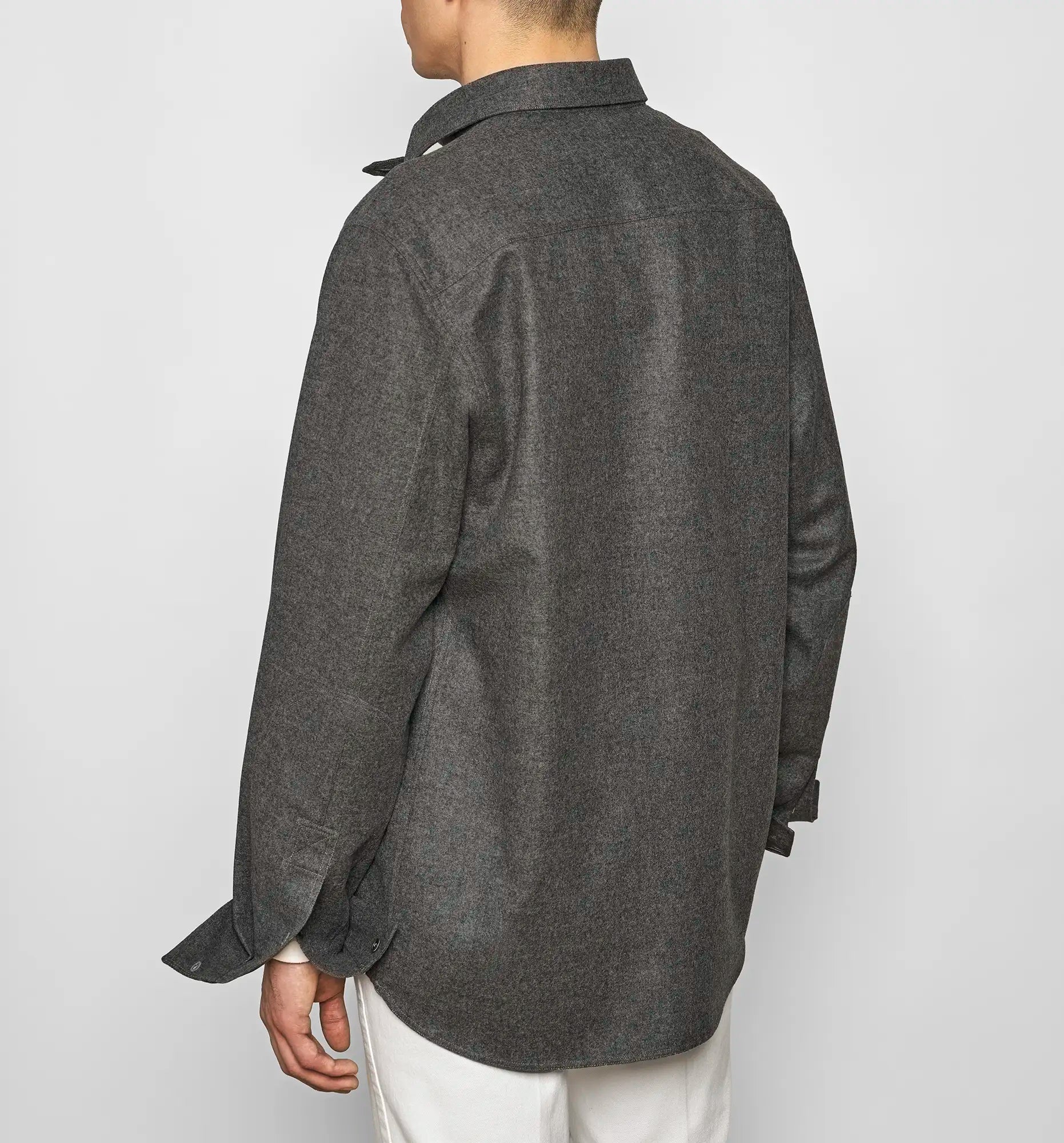 Back view of a charcoal gray Sébline shirt worn by a model