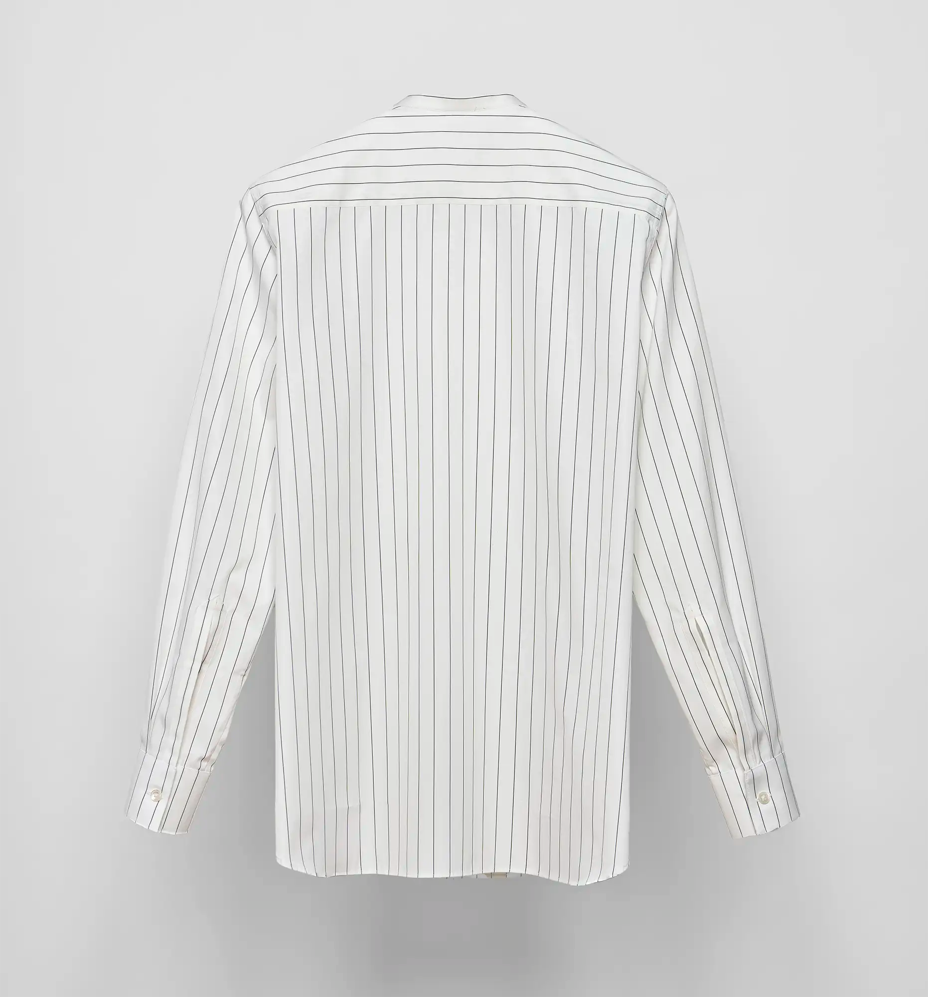 Sébline long-sleeve white shirt with black pinstripes, back flat lay on grey background.