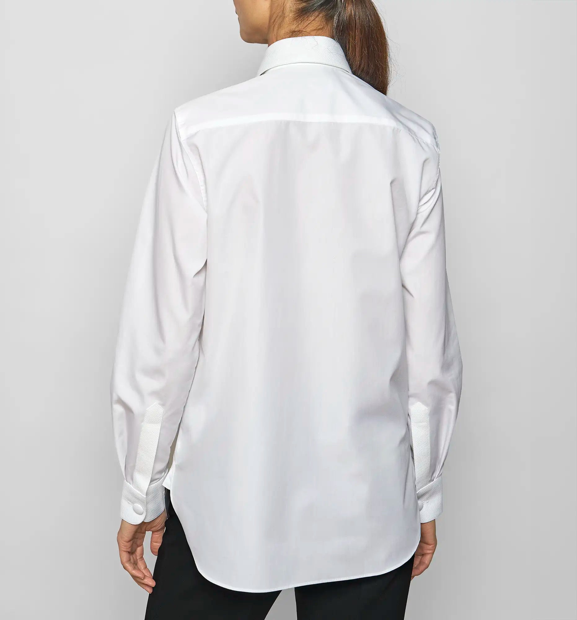 Model wearing Sébline white shirt, back view.