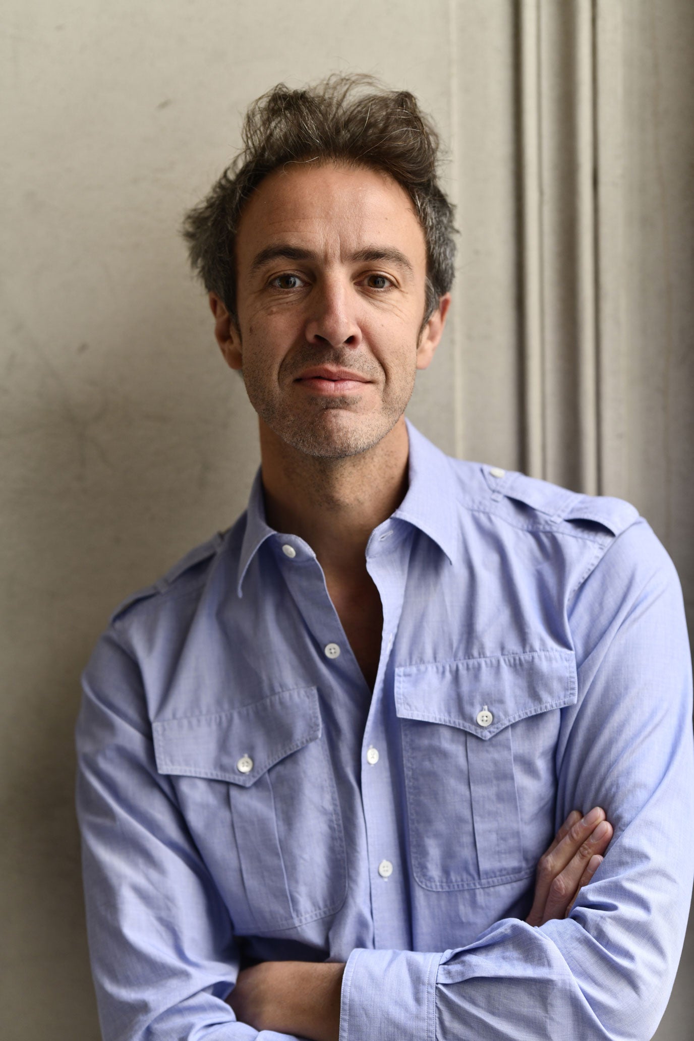 Charles Sébline wearing a light blue shirt.