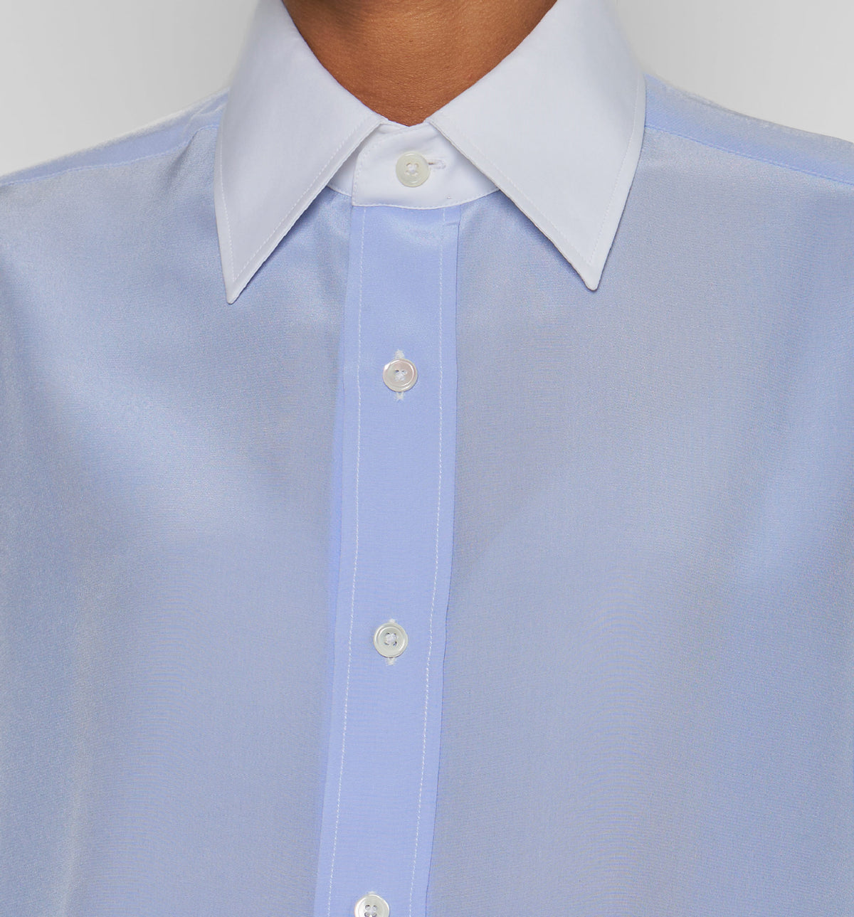 Women's Work Shirt – close-up of light blue shirt showing collar, front placket and white buttons, on model