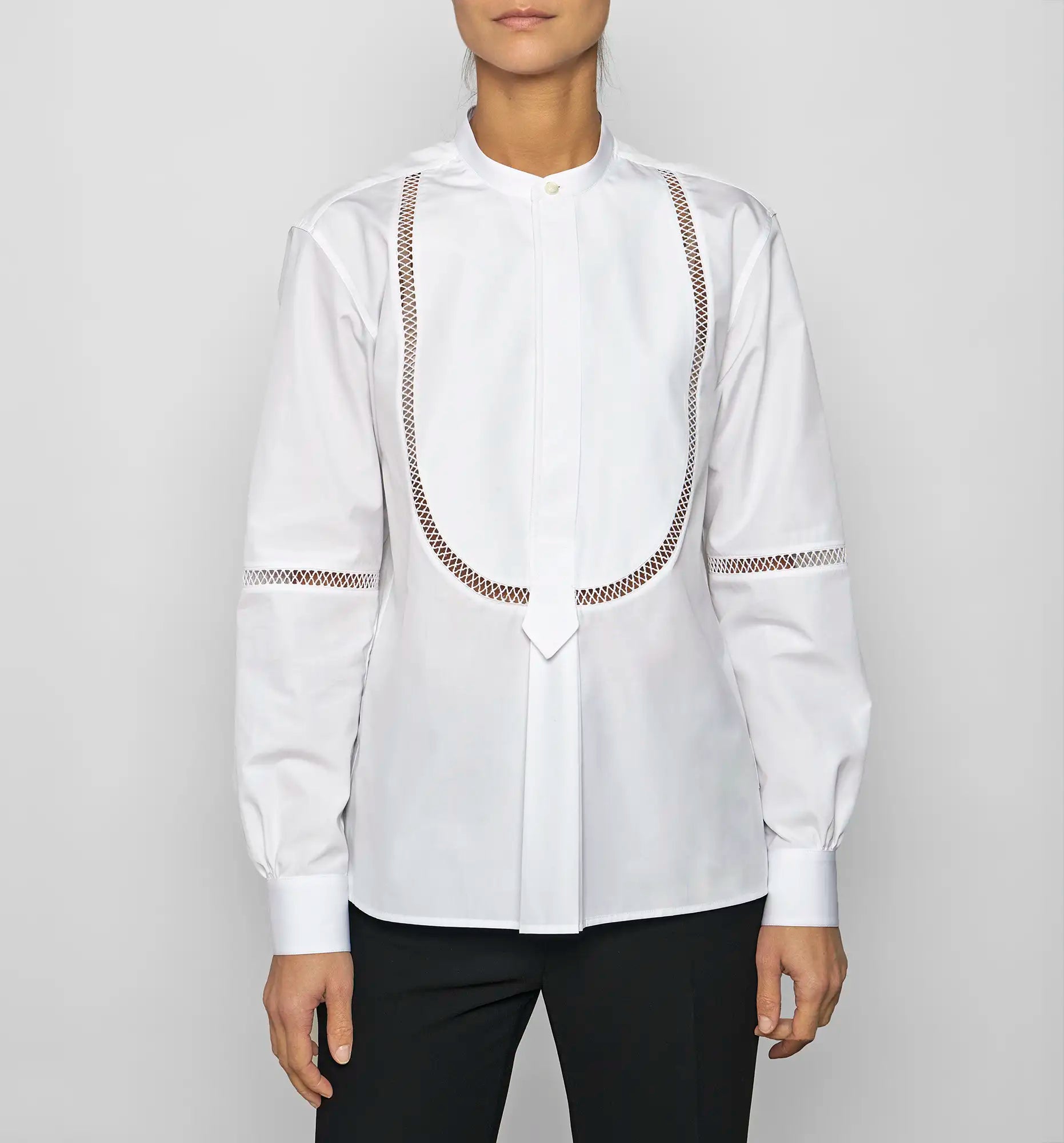 Front view of a model wearing the white Venetian Painter’s Shirt by Sébline, highlighting the bibbed front detail.