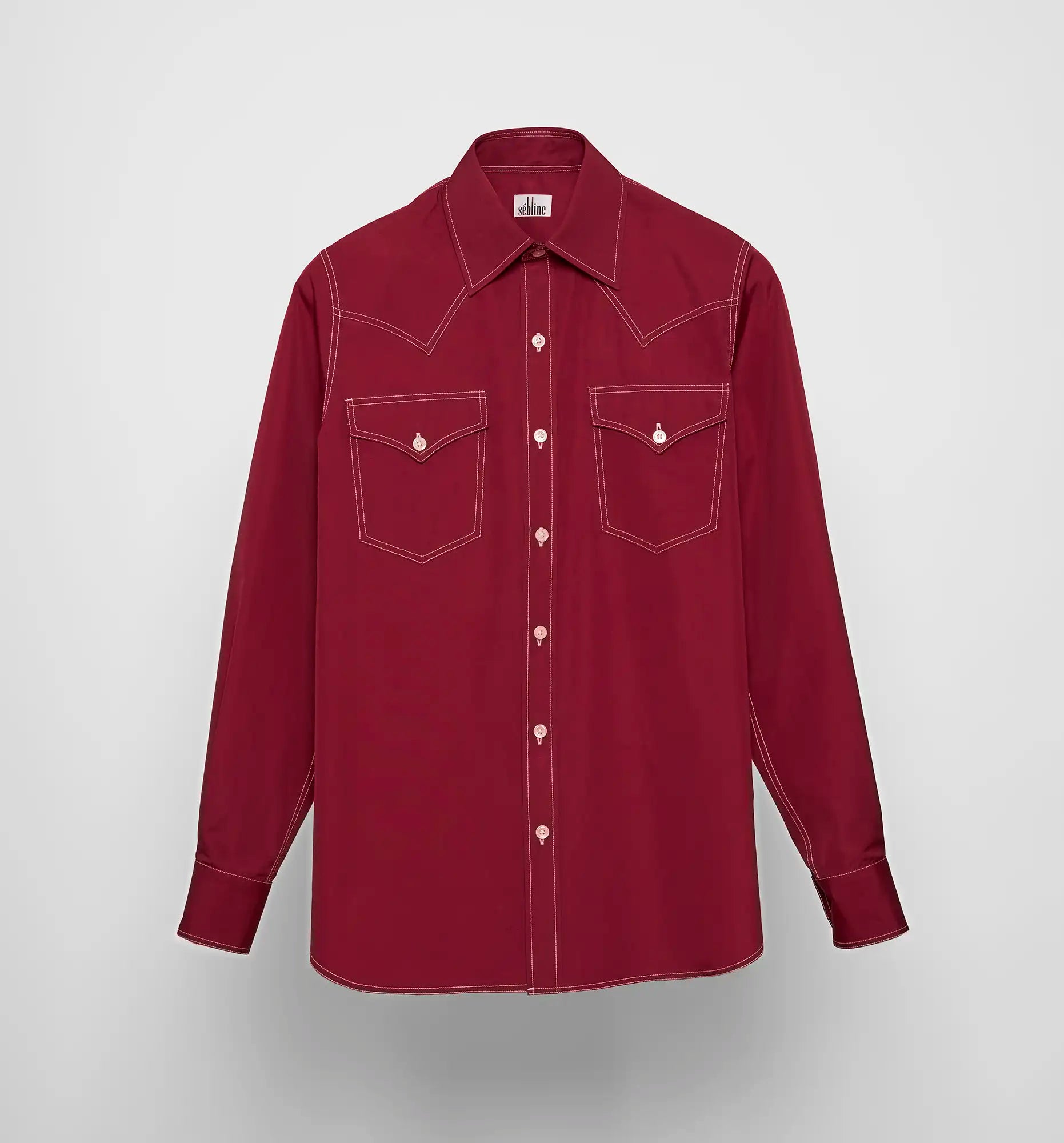 Front view of the Sébline cowboy shirt in bordeaux cotton poplin with white contrast topstitching and chest pockets.