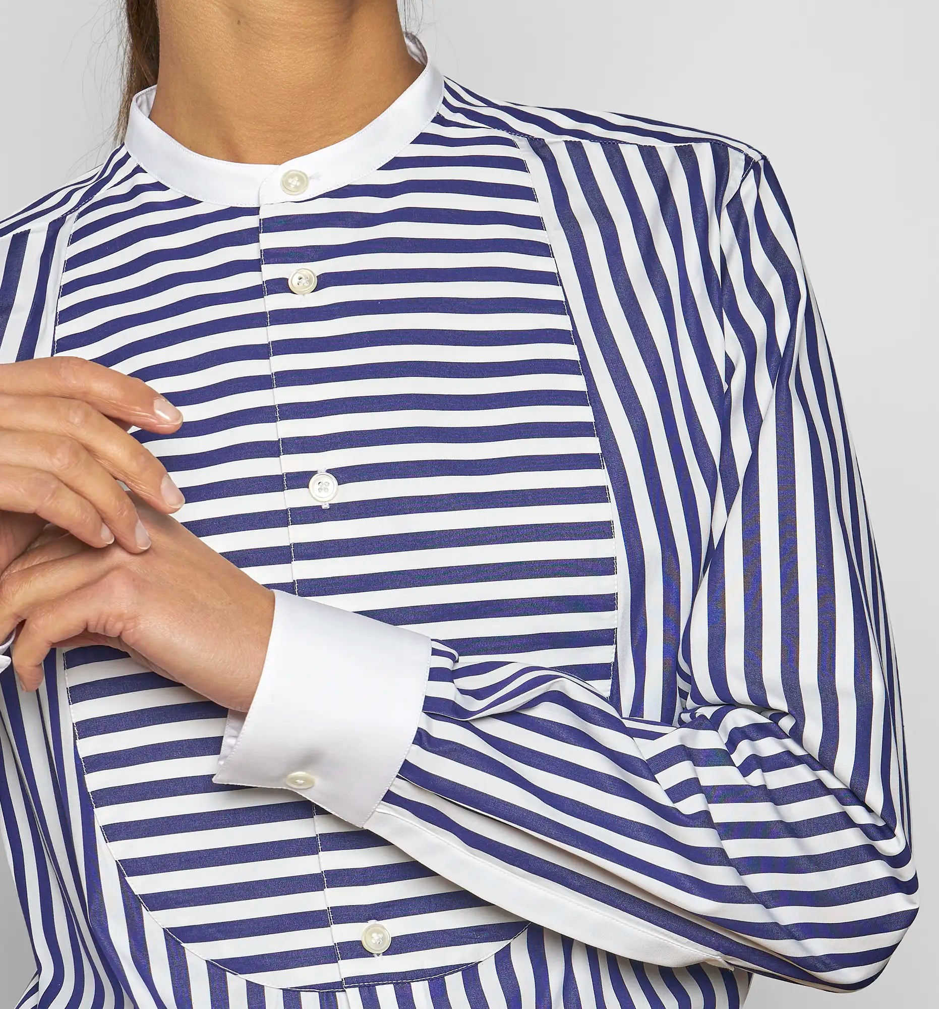 Close-up of a Sébline navy-and-white striped shirt showing the striped bib and collar area.