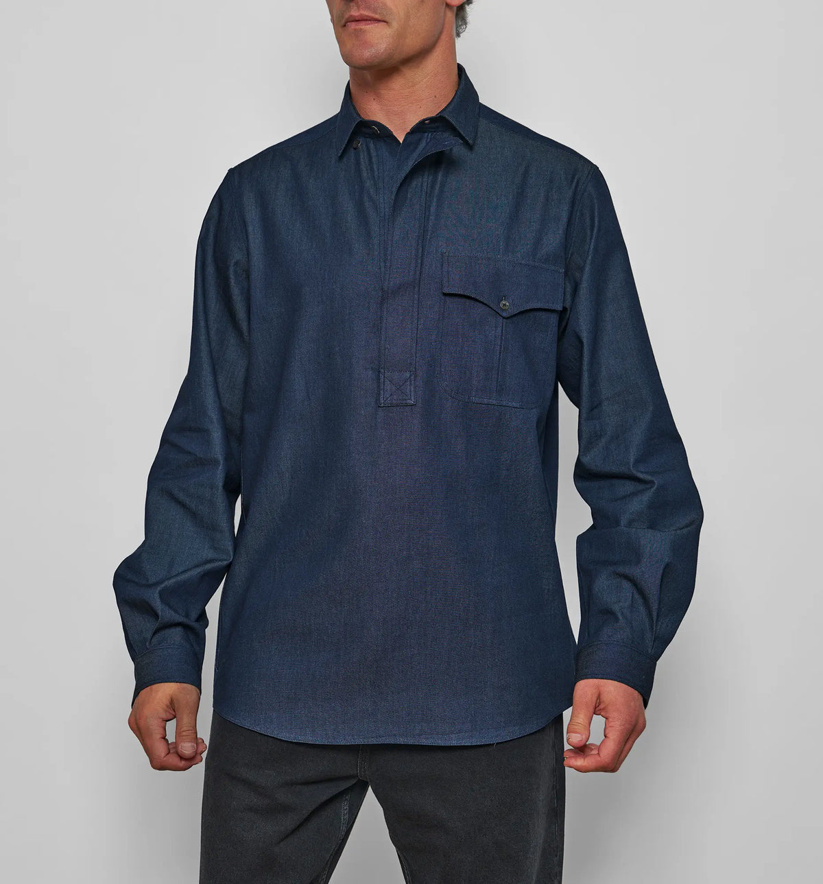 Combat Polo Shirt – Model wearing the denim twill pullover shirt, front view