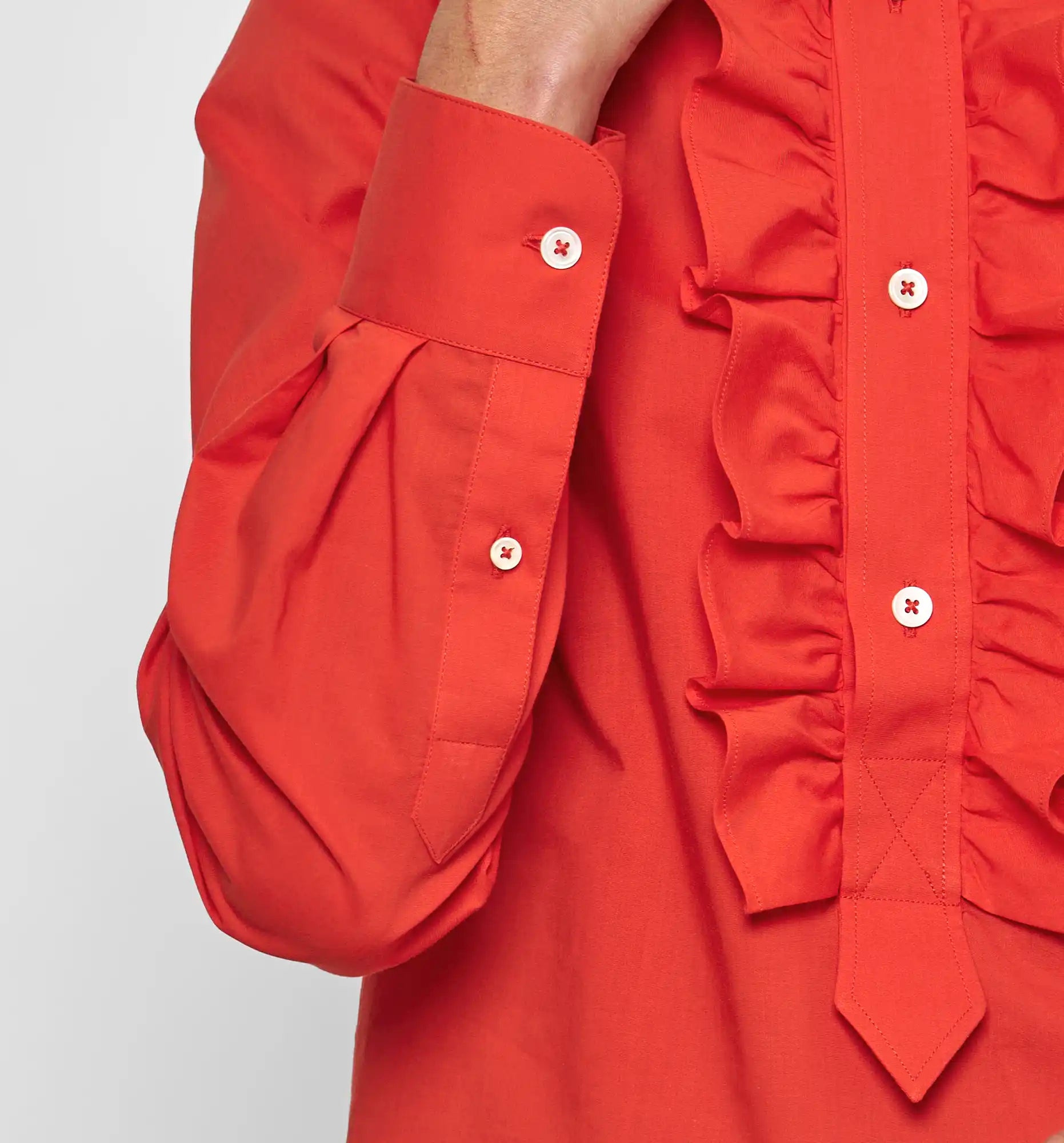 Ruffle polo shirt in poppy red — sleeve ruffle detail